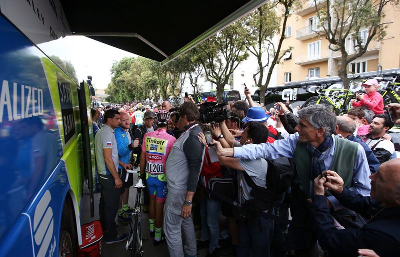 Alberto Contador fields questions about his shoulder at the team bus