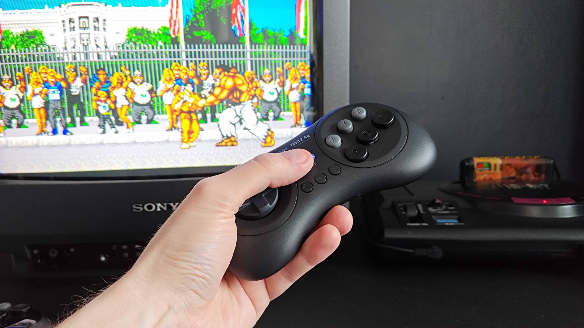 Phil Hayton pressing 8Bitdo M30 start button with Sony CRT displaying Street Smart for Sega Mega Drive with no response from game.
