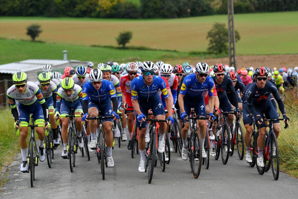 TOURNAI BELGIUM SEPTEMBER 29 LR Loic Vliegen of Belgium and Team Intermarch Wanty Gobert Matriaux Baptiste Planckaert of Belgium and Team Intermarch Wanty Gobert Matriaux Stijn Steels of Belgium and Team Deceuninck QuickStep Iljo Keisse of Belgium and Team Deceuninck QuickStep Dries Devenyns of Belgium and Team Deceuninck QuickStep Owain Doull of United Kingdom and Team INEOS Grenadiers and Leonardo Basso of Italy and Team INEOS Grenadiers during the 80th Euromtropole Tour 2021 a 1776km race from La Louvire to Tournai Eurometrotour on September 29 2021 in Tournai Belgium Photo by Luc ClaessenGetty Images