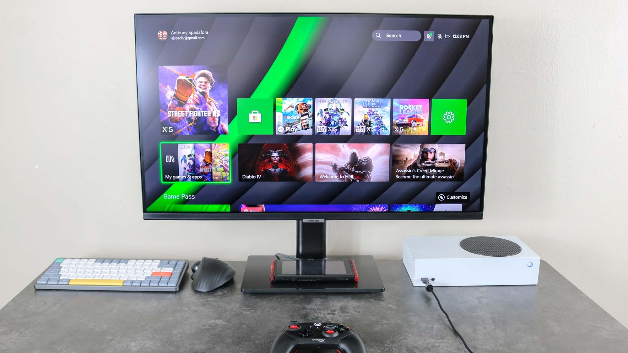 A Xbox Series S on a desk with a monitor
