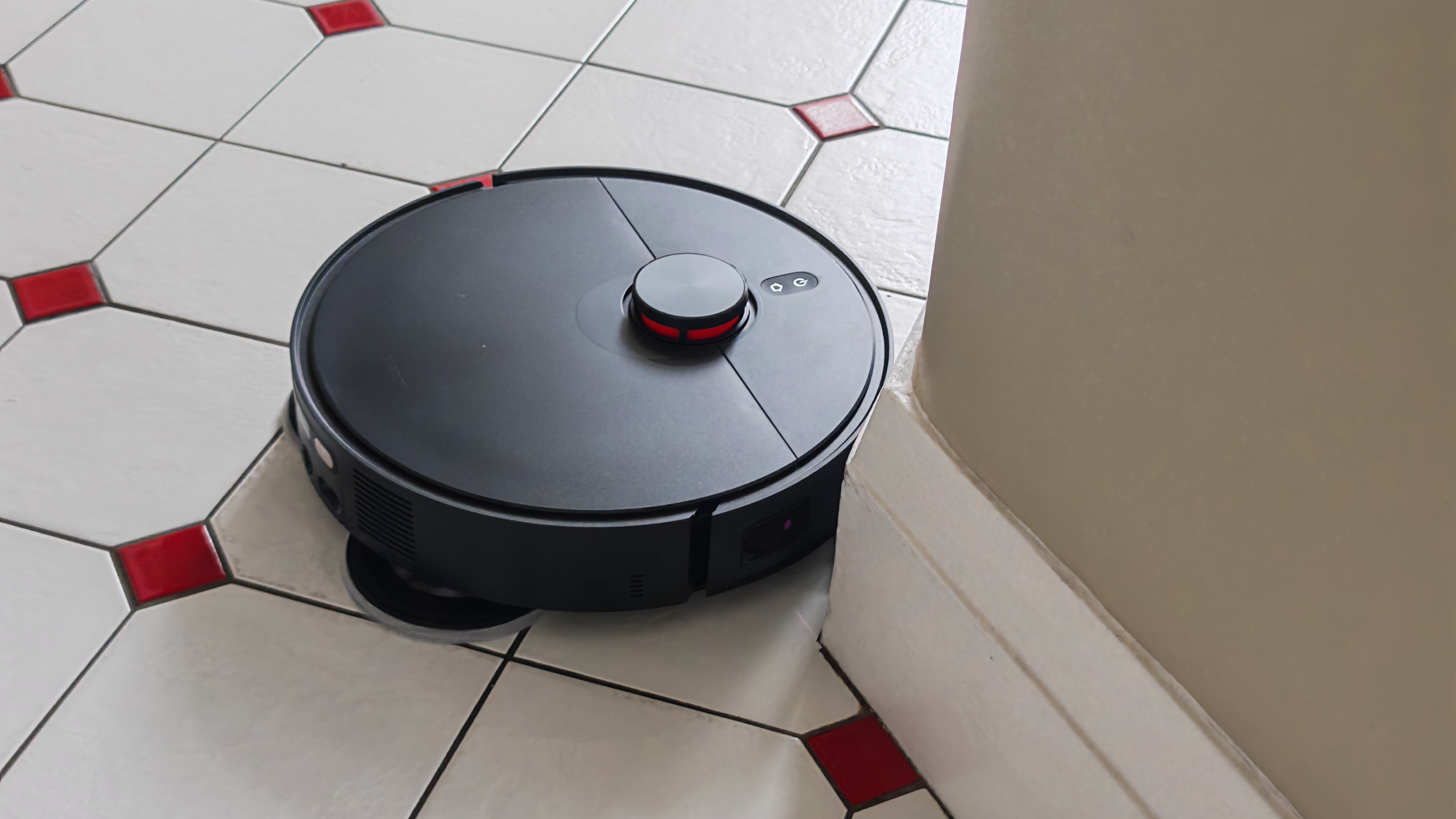 The Robot Vacuum X20 Max from Xiaomi in a hallway with a tiled floor.