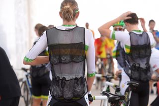 Female pro cyclist wearing a ice vest