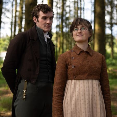 Mary Bennet (ELLA BRUCCOLERI) and Mr Hayward (D&Oacute;NAL FINN) stand in a forest, in 'The Other Bennet Sister.'