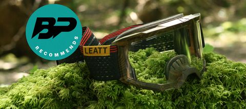 Leatt Velocity 4.0 MTB X-Flow Goggles sitting on mossy rock with a Bike Perfect recommends logo
