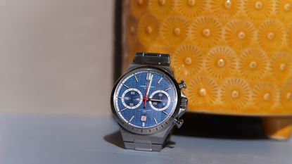 The Certina DS-7 Chrono Auto against a yellow pot