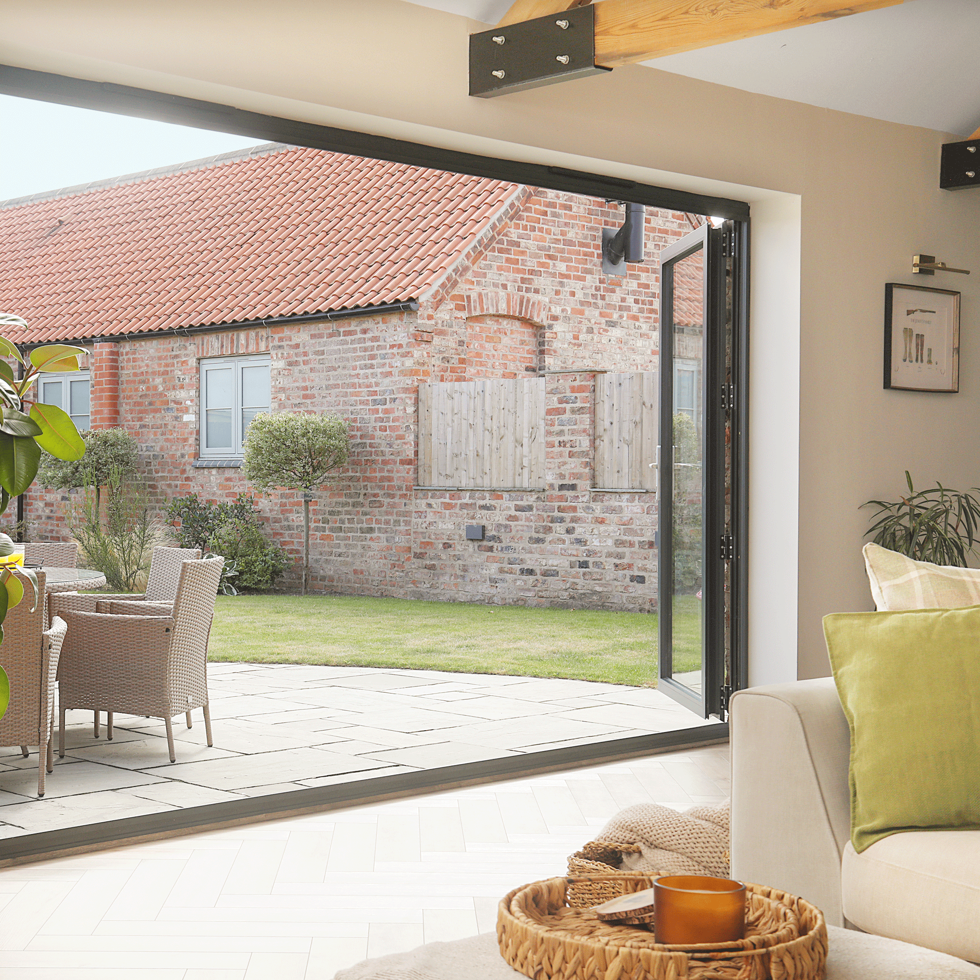 the view from a house out into the garden via open patio doors