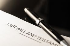 A close-up view of a last will and testament document with a sleek pen. Represents essential legal planning for individuals managing estates and asset distribution.