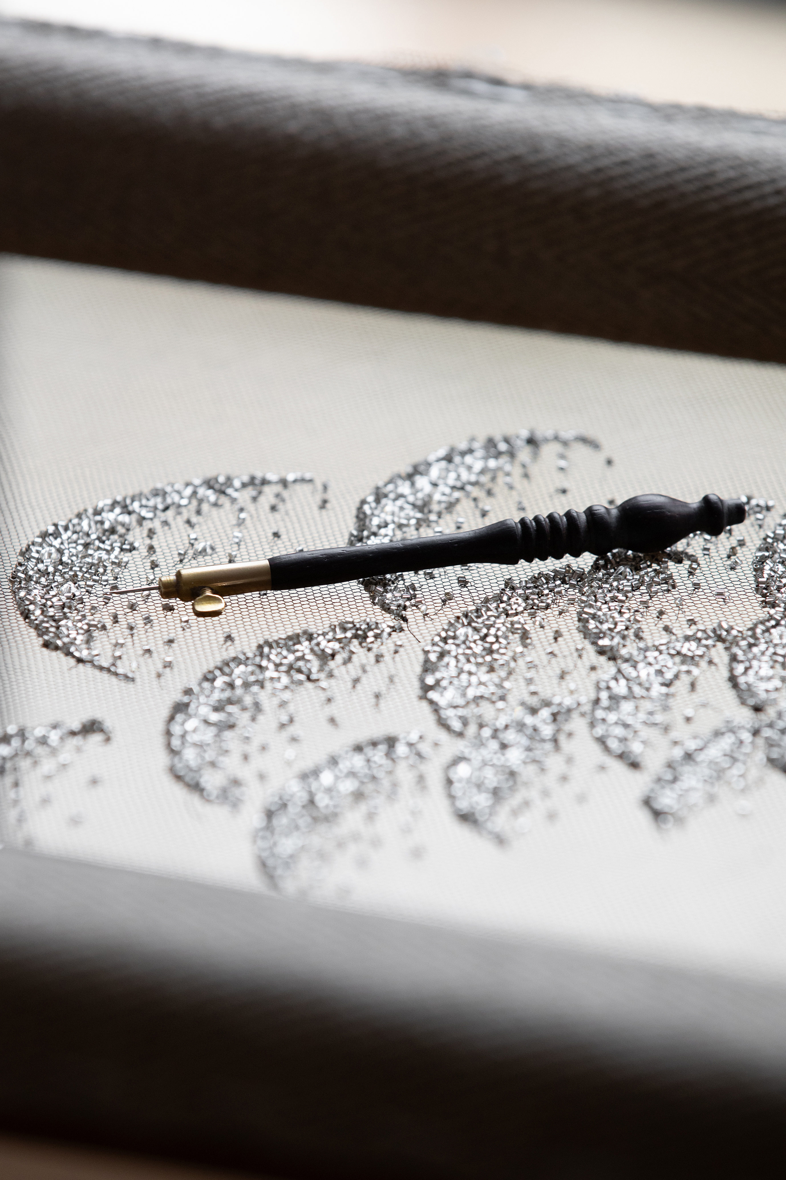 a close up of dior glitter in the dior workshop