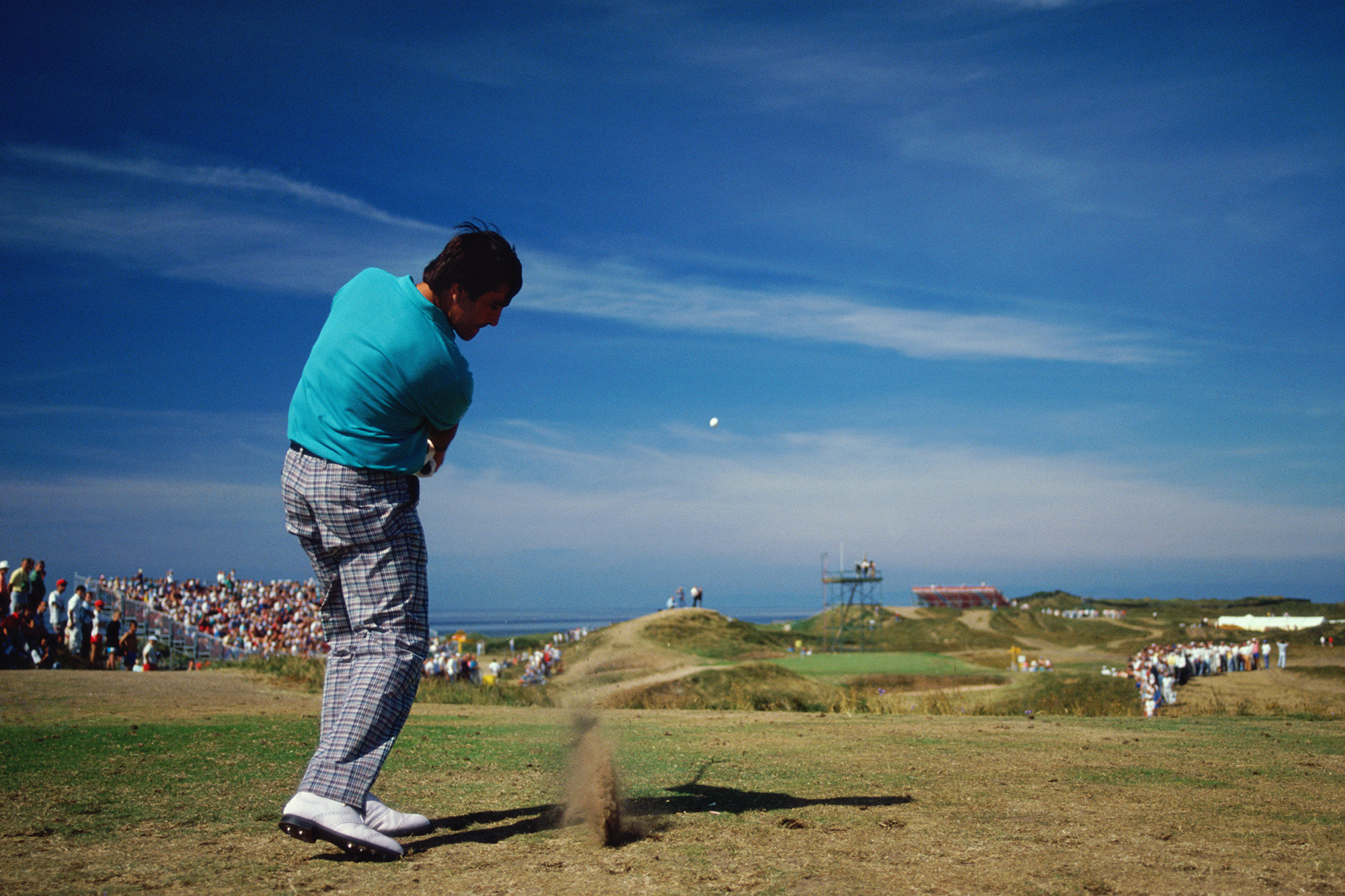 Seve Ballesteros controlling his ball flight from a tee shot with an iron
