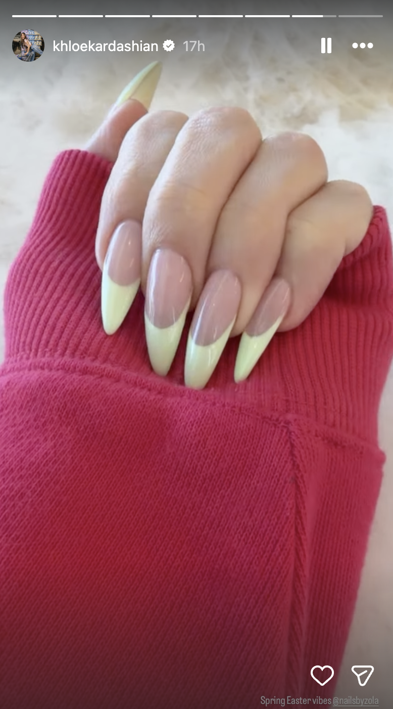 a person wearing a pastel french manicure