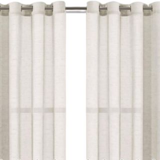 A set of white linen curtains on a pole