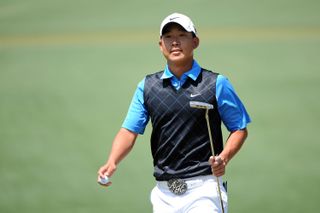 Anthony Kim walks across the second green during the final round of the 2009 Masters Tournament at Augusta National Golf Club on April 12, 2009