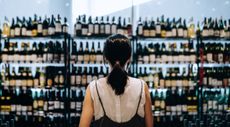 Woman shopping for duty free wine