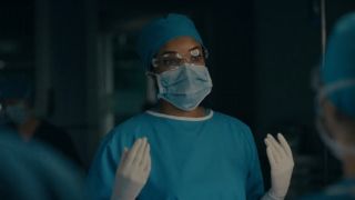 Rochelle Aytes as Mary Morstan performing surgery in Watson