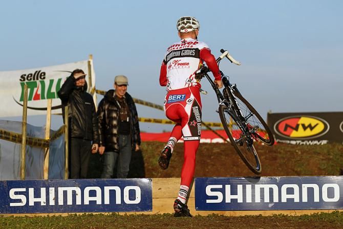 Klaas Vantornout (Sunweb-Napoleon Games) runs a barrier section.