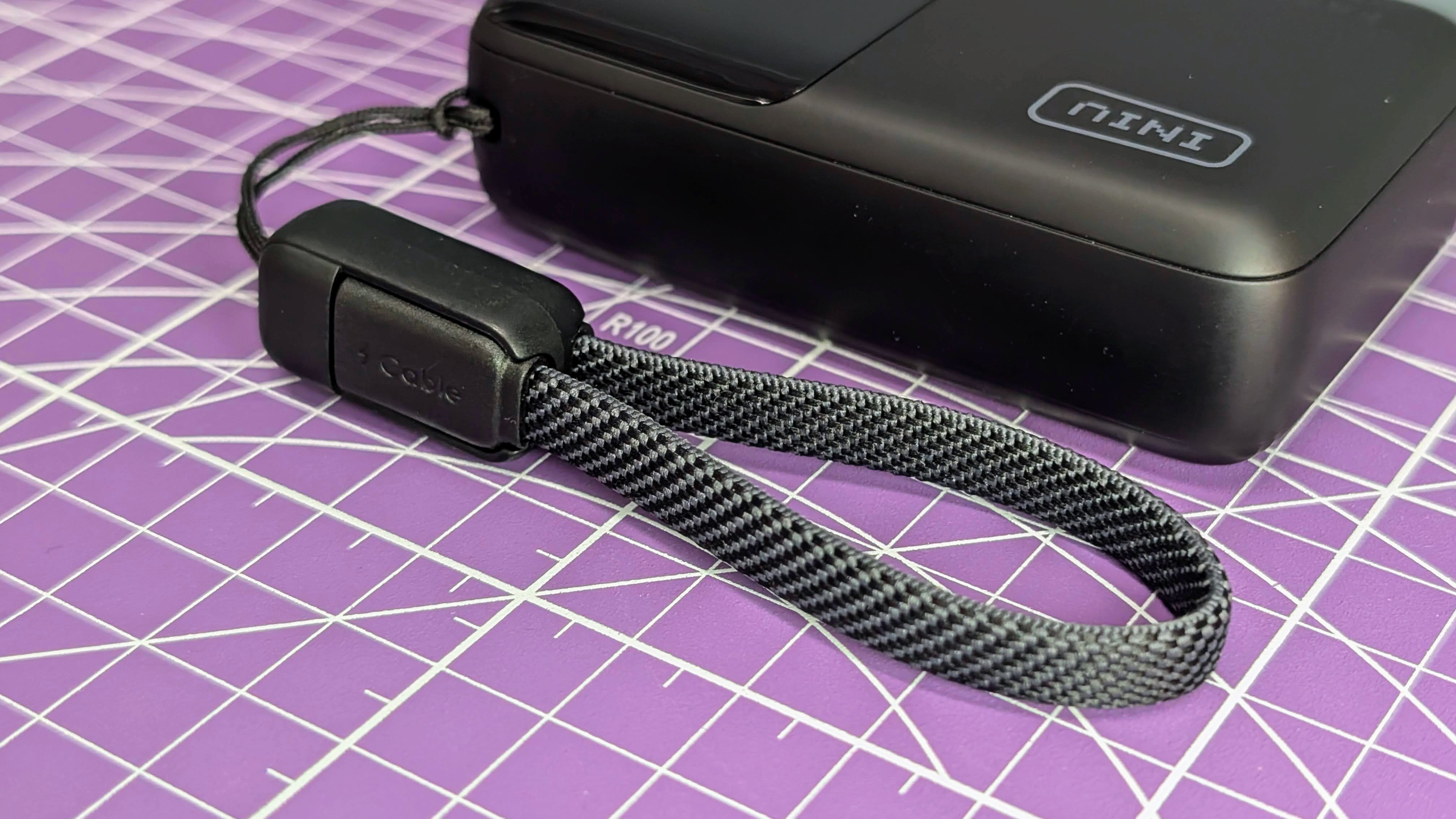 Iniu P50-E1 45W power bank showing lanyard cable