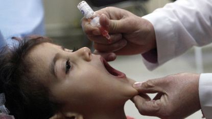 A child receives a vaccine