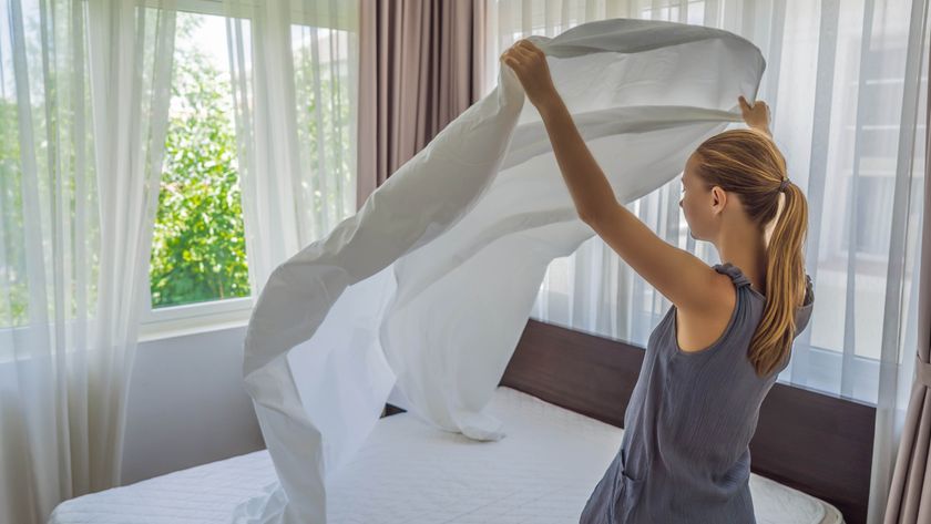 Woman changing bedding