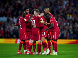 Liverpool players celebrate Jordan Henderson's winner