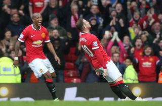 Wayne Rooney falls backwards in a comical "knockout" celebration after scoring for Manchester United against Tottenham in 2015, following reports he had been knocked out in a friendly boxing match by former team-mate David Bardsley.