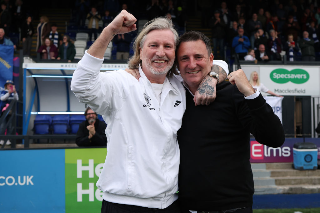 Robbie Savage, manager of Macclesfield, celebrates with the club owner Robert Smethurst after their side are confirmed as Northern Premier League champions