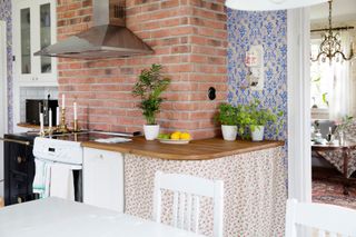 Scandi kitchen with brick wall