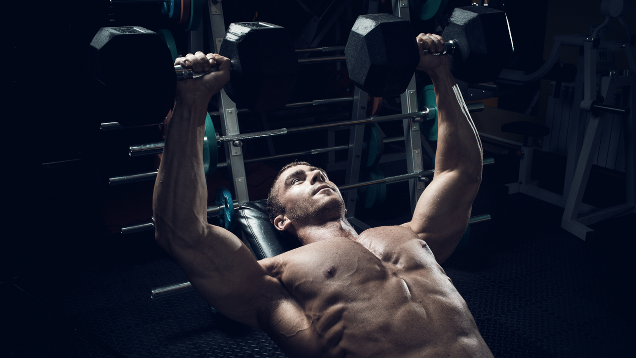 Man doing dumbbell chest press