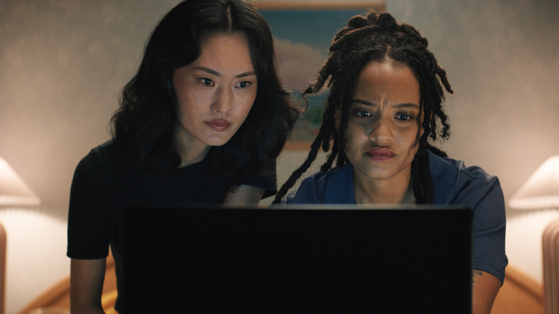 Keiko and May looking at a laptop in Monarch: Legacy of Monsters season 2 episode 4