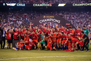 Players of Chile celebrate with the trophy after the championship match between Argentina and Chile at MetLife Stadium as part of Copa America Centenario 2016 on June 26, 2016 in East Rutherford, New Jersey, USA. (Photo by Stringer/Anadolu Agency/Getty Images)