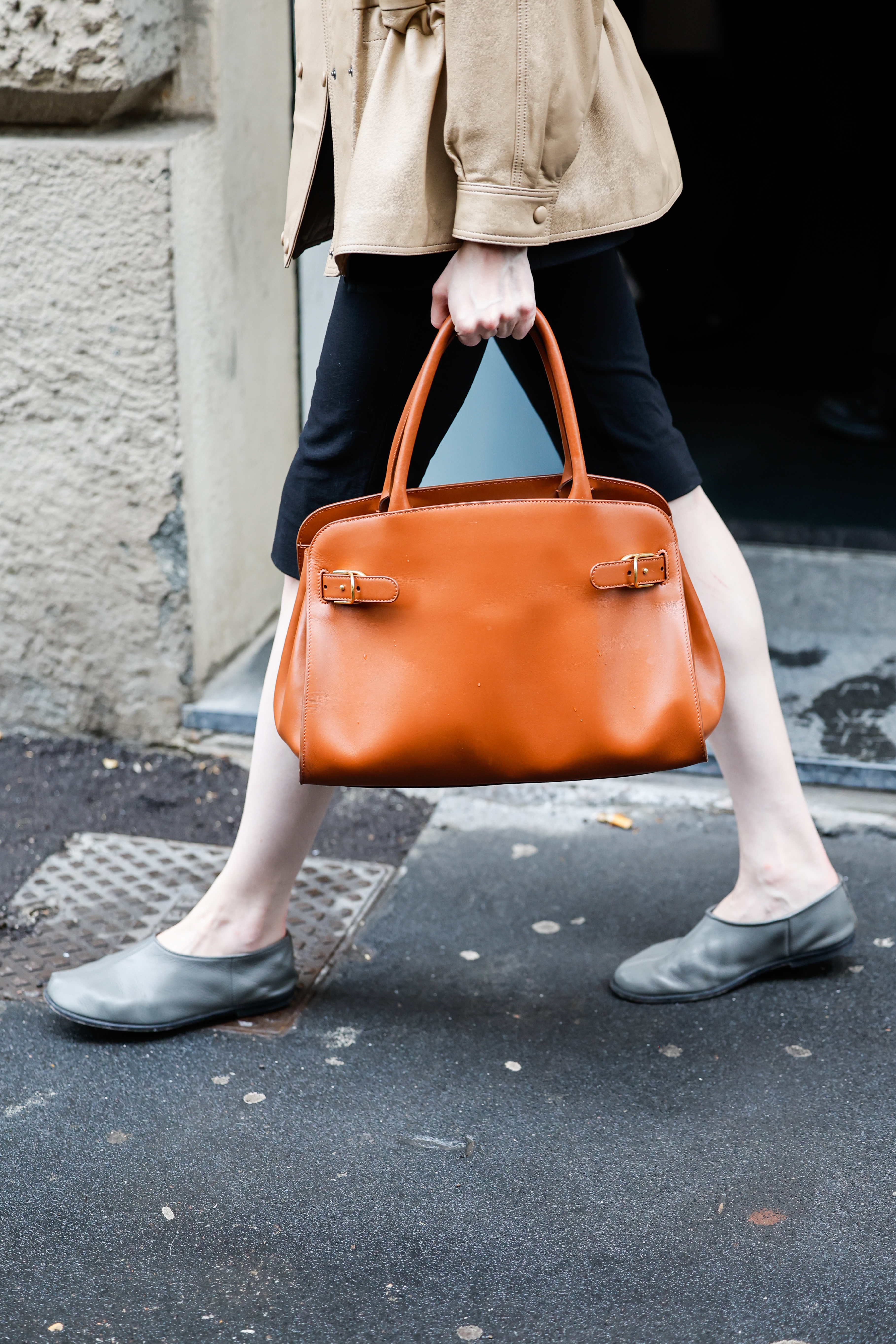 A guest at Milan Fashion Week Spring 2026 wearing the high-vamp flats trend