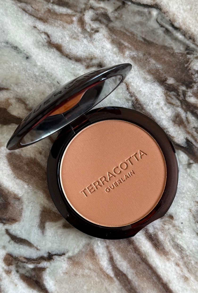 Guerlain terracotta bronzer on marble table
