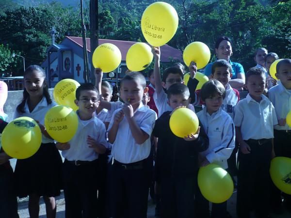 School children came out to cheer on passing racers.