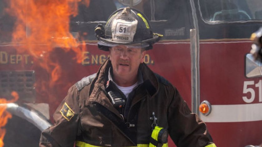 Christian Stolte as Mouch walking away from a fire in Chicago Fire 14x01