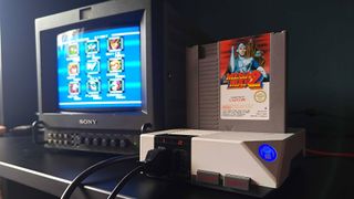 Hyperkin Retron HD connected to Sony PVM CRT with Mega Man 2 cartridge inserted and level select on screen.