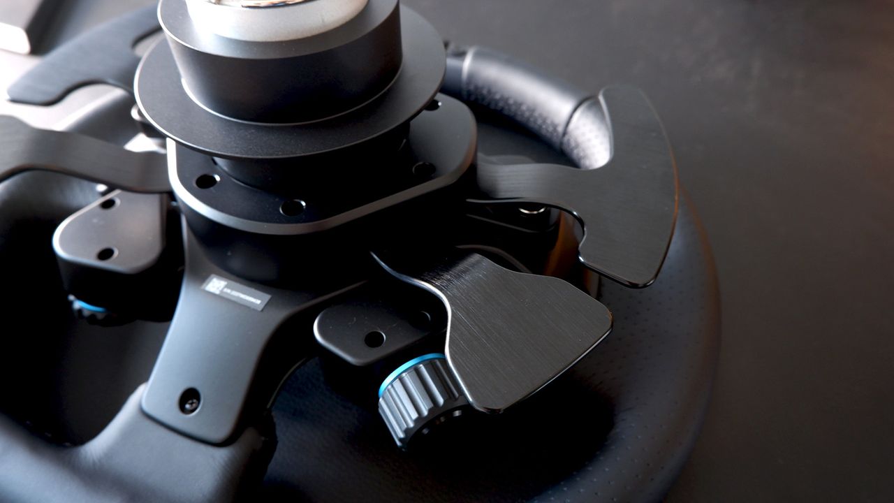 Logitech G Pro Racing Wheel and Pedals installed on a computer desk