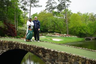 Tom Clarke and caddie Drake on the 12th hole at Augusta National