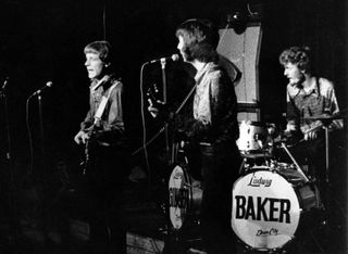 (from left) Jack Bruce, Eric Clapton, and Ginger Baker perform onstage