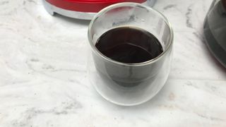 A cup of coffee brewed from the Smeg Drip Coffee Maker