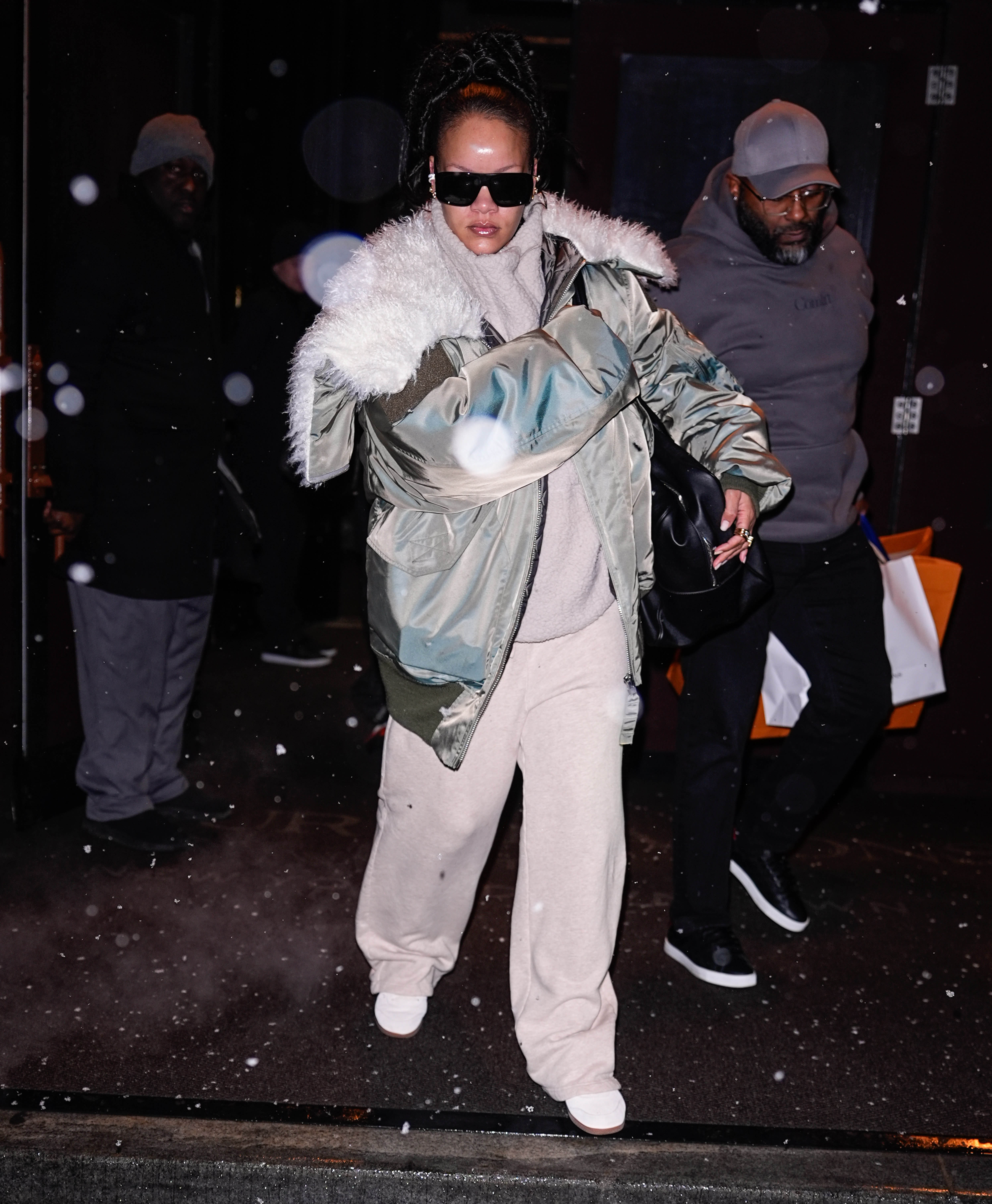 Rihanna was spotted in New York City wearing mysterious white-and-black, suede Puma sneakers with a puffer jacket and sweatsuit