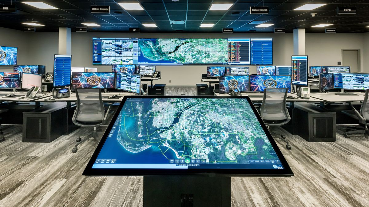 The Real-Time Intelligence Center in Lee County, FL, monitors public safety data. A centrally located touchscreen allows for collaboration of county assets (land, air and sea) to provide real-time, predictive, modern policing.