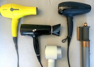 a selection of the best hair dryers tested for this piece by Drybar, T3, Zuvi, ghd and Dyson