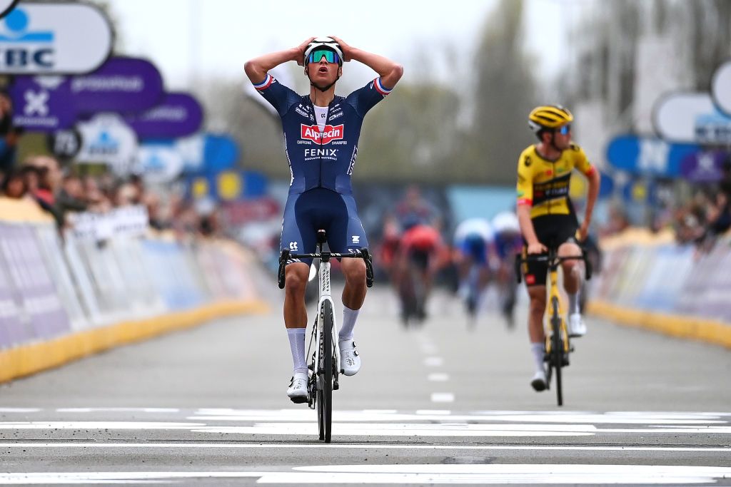 WAREGEM BELGIUM MARCH 30 Mathieu Van Der Poel of Netherlands and Team AlpecinFenix celebrates at finish line as race winner during the 76th Dwars Door Vlaanderen 2022 Mens Elite a 1837km one day race from Roeselare to Waregem DDV22 DDVmen WorldTour on March 30 2022 in Waregem Belgium Photo by Tim de WaeleGetty Images