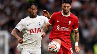 Destiny Udogie and Dominik Szoboszlai challenge for the ball in Tottenham's 2-1 win over Liverpool in September 2023.