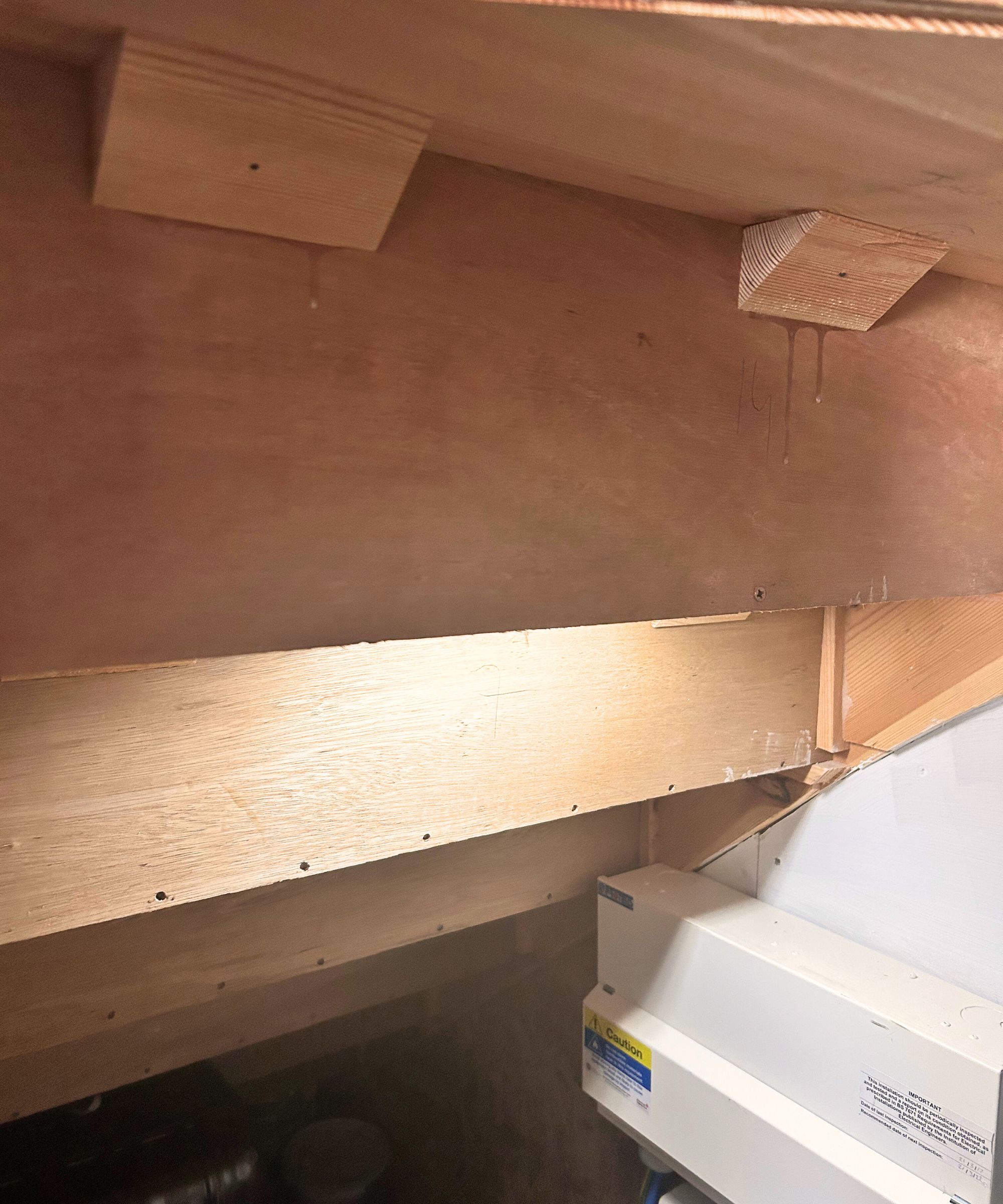 Under the stairs cupboard with a lighting strip