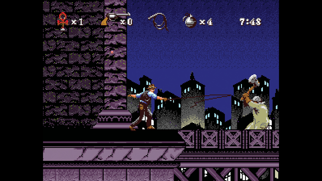 A young Indy whips an enemy holding an axe on a city rooftop in Instruments of Chaos starring Young Indiana Jones - from Retro Gamer magazine