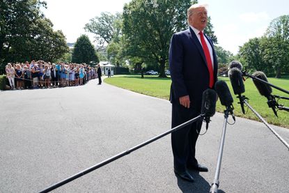 President Trump standing.