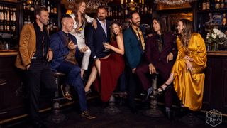 The cast of Critical Role at a bar, laughing