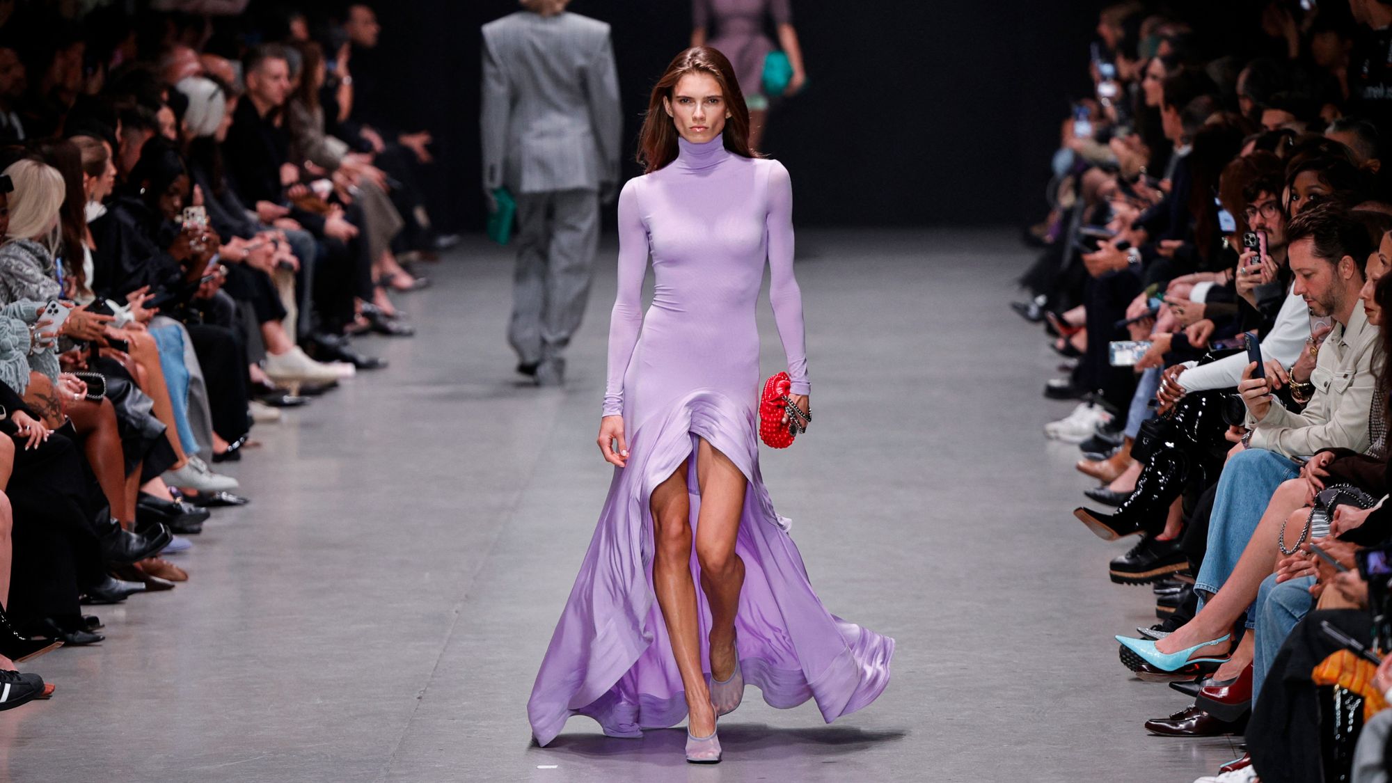 a model wears a lilac dress on the stella mccartney ss26 runway
