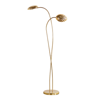 A gold shell floor lamp