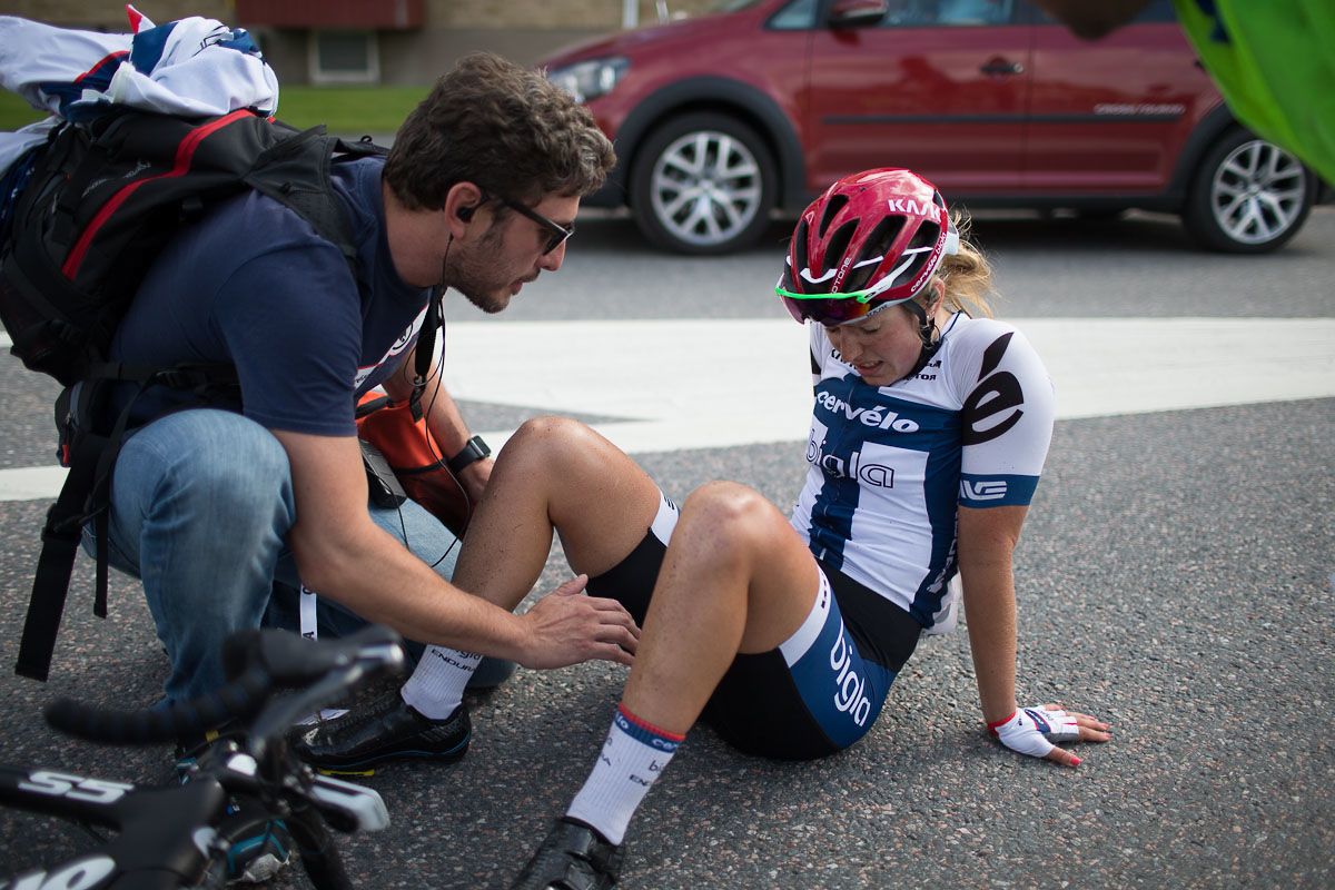 An exhausted Lotta Lepist&ouml; (FIN) of Cerv&eacute;lo-Bigla Cycling Team sits on the ground after finishing in second place